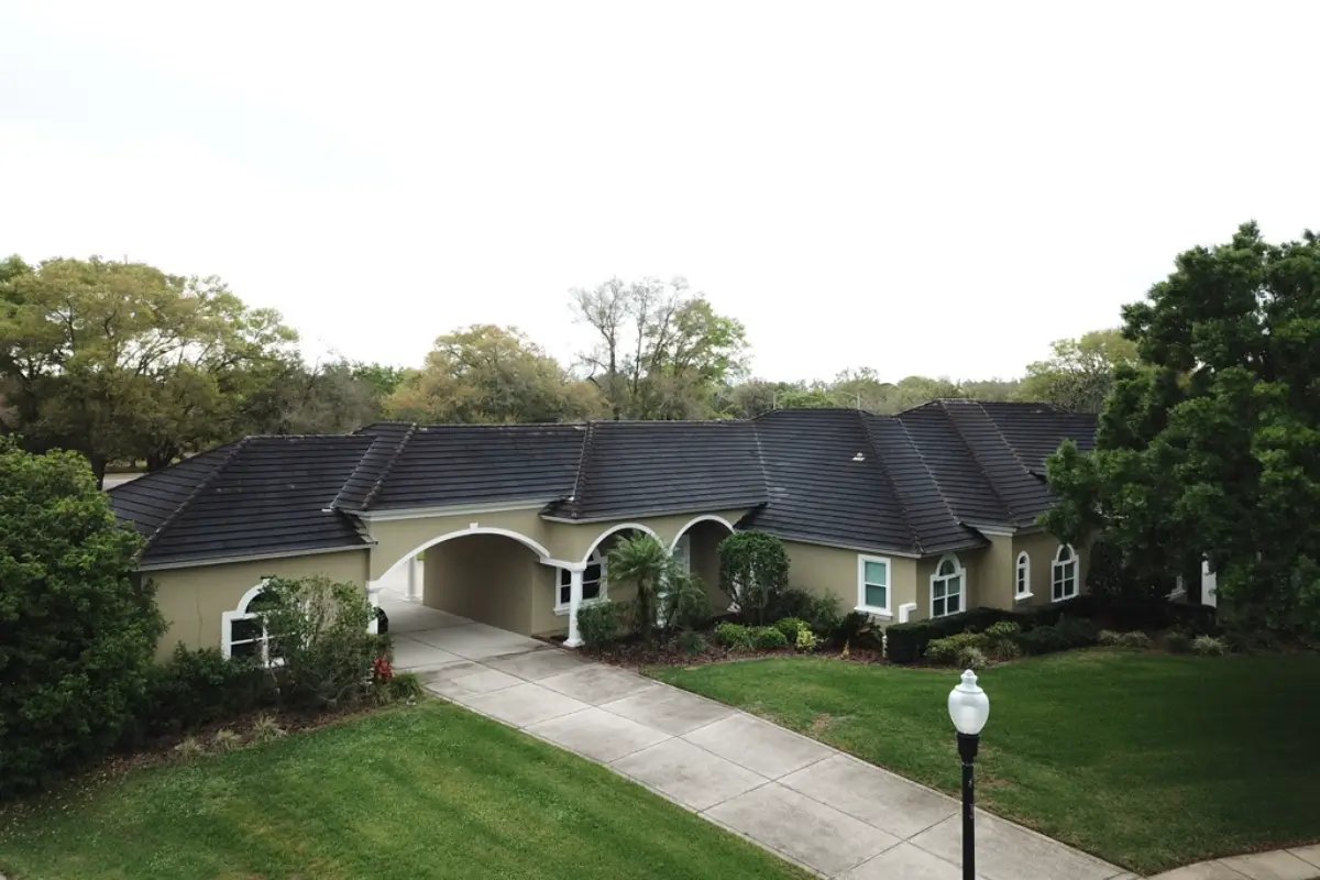 Aerial photo of residential roofing project showing complete roof system and surrounding property